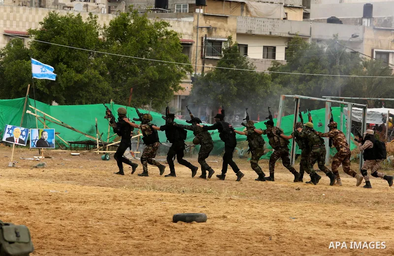 Palestinian high-school students show off their skills during a graduation ceremony from a military school course organised by the Palestinian security forces in Gaza strip, in Gaza City, on April 2, 2017. Photo by Ashra...