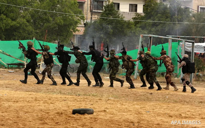 Palestinian high-school students show off their skills during a graduation ceremony from a military school course organised by the Palestinian security forces in Gaza strip, in Gaza City, on April 2, 2017. Photo by Ashra...