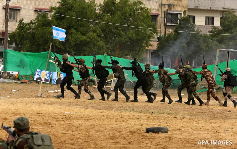Palestinian high-school students show off their skills during a graduation ceremony from a military school course organised by the Palestinian security forces in Gaza strip, in Gaza City, on April 2, 2017. Photo by Ashra...