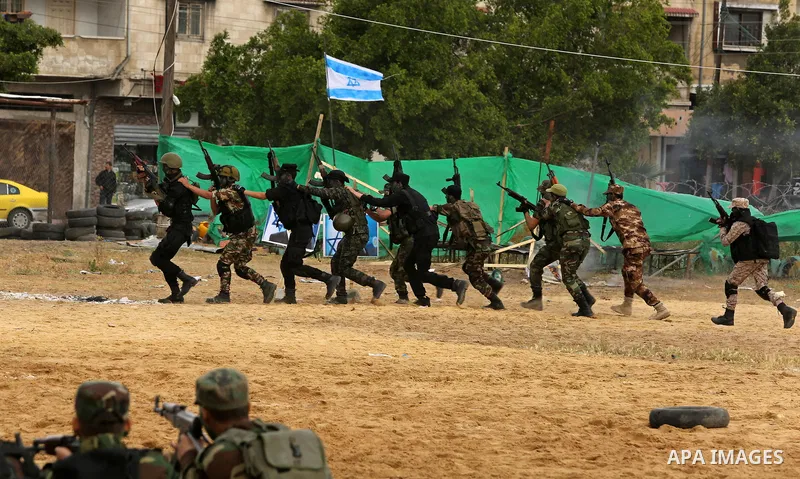 Palestinian high-school students show off their skills during a graduation ceremony from a military school course organised by the Palestinian security forces in Gaza strip, in Gaza City, on April 2, 2017. Photo by Ashra...