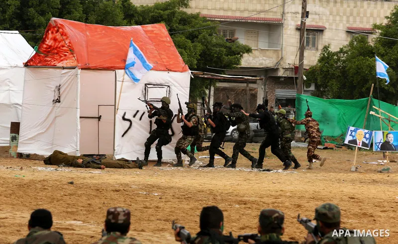 Palestinian high-school students show off their skills during a graduation ceremony from a military school course organised by the Palestinian security forces in Gaza strip, in Gaza City, on April 2, 2017. Photo by Ashra...