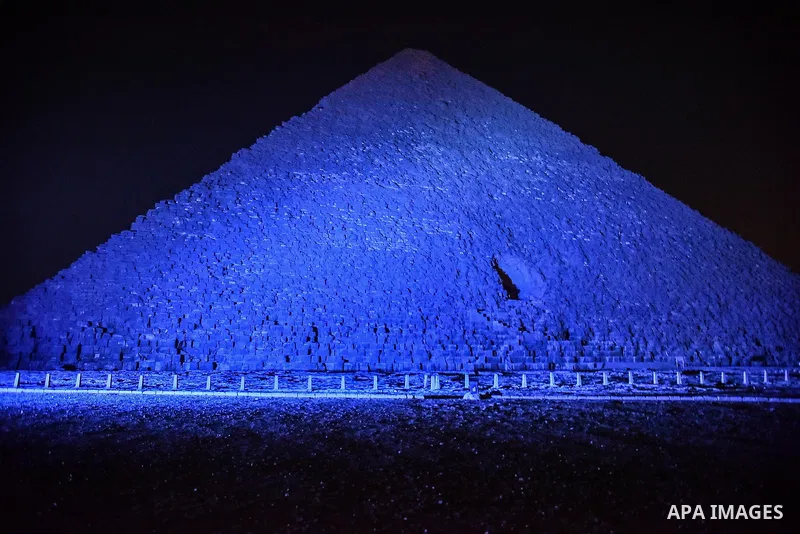 The Pyramid of Khufu, the largest of the Great Pyramids of Giza is lit in blue in honor of World Autism Awareness Day, on the outskirts of Cairo, Egypt on April 02, 2017. Photo by Amr Sayed