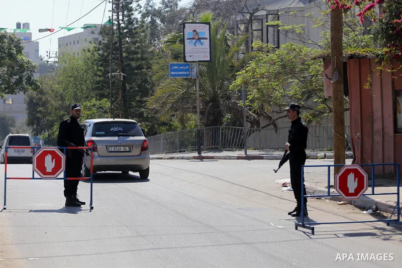 Palestinian policemen inspect cars at a check point at street in Gaza city, on April 04, 2017, coinciding Ministry of Interior in the Gaza Strip launches a week-long campaign to encourage "collaborators" with Israel to r...