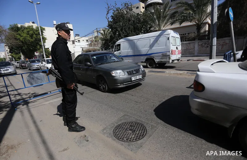 Palestinian policemen inspect cars at a check point at street in Gaza city, on April 04, 2017, coinciding Ministry of Interior in the Gaza Strip launches a week-long campaign to encourage "collaborators" with Israel to r...