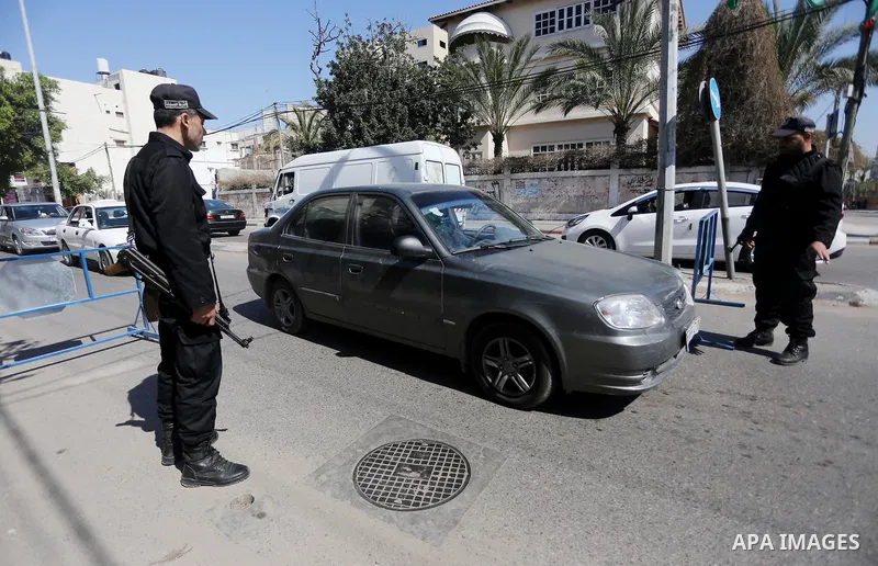 Palestinian policemen inspect cars at a check point at street in Gaza city, on April 04, 2017, coinciding Ministry of Interior in the Gaza Strip launches a week-long campaign to encourage "collaborators" with Israel to r...