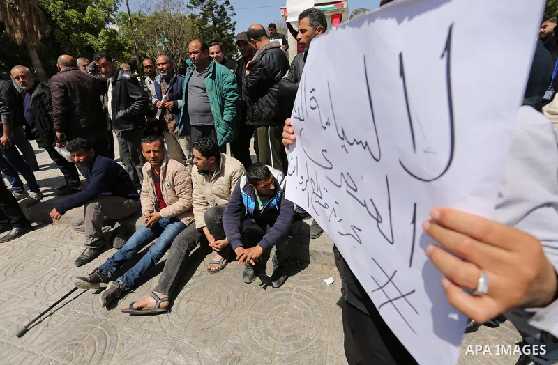 Palestinian employees paid by the Palestinian Authority take part in a protest against the decision of Palestinian goverment to deduct salaries of employees about 30%, in Gaza City April 5, 2017. Photo by Ashraf Amra