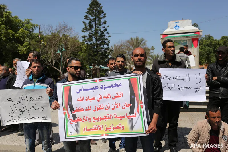 Palestinian employees paid by the Palestinian Authority take part in a protest against the decision of Palestinian goverment to deduct salaries of employees about 30%, in Gaza City April 5, 2017. Photo by Ashraf Amra