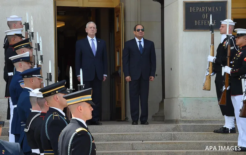 US Defense Secretary James Mattis and Egypt's President Abdel Fattah al-Sisi listen to national anthems during a welcome ceremony as al-Sisi arrives for meetings at the Pentagon, in Washington, United States on April 5,...