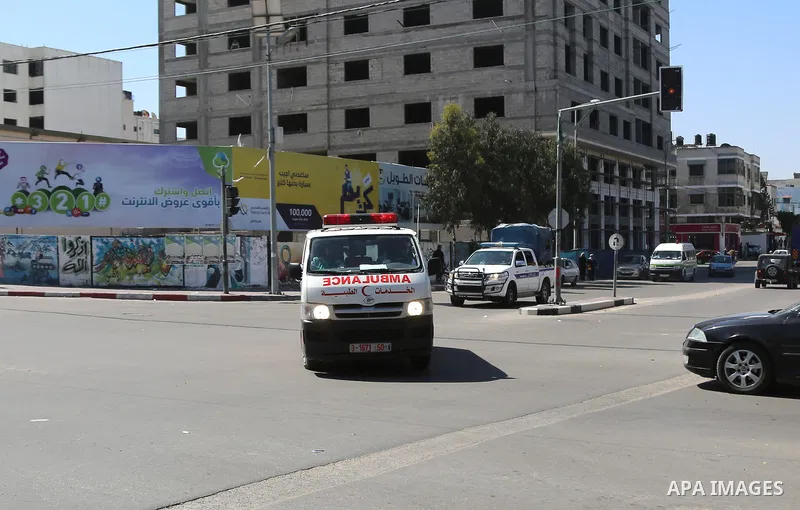 An ambulance transporting the bodies of men accused of collaborating with Israel leaves the main police building in Gaza City on April 6, 2017. Gaza's Hamas rulers hanged three men they accused of collaborating with Isra...