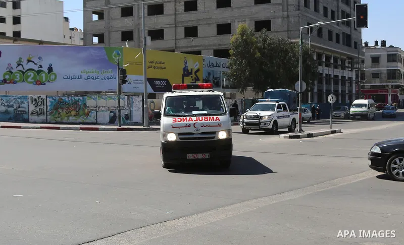 An ambulance transporting the bodies of men accused of collaborating with Israel leaves the main police building in Gaza City on April 6, 2017. Gaza's Hamas rulers hanged three men they accused of collaborating with Isra...
