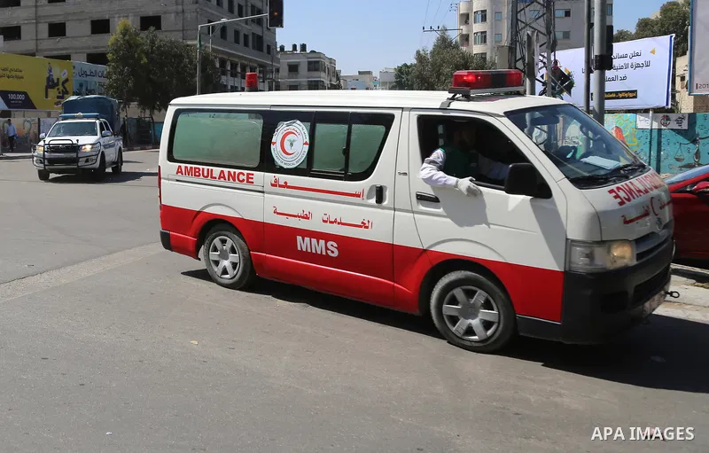 An ambulance transporting the bodies of men accused of collaborating with Israel leaves the main police building in Gaza City on April 6, 2017. Gaza's Hamas rulers hanged three men they accused of collaborating with Isra...