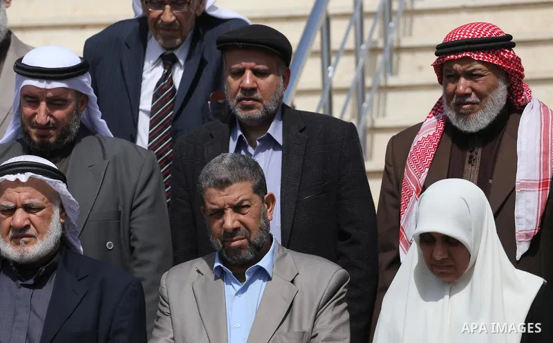 Palestinian Members of the Legislative council take part in a protest in Gaza city, on April 9, 2017. Photo by Mohammed Asad