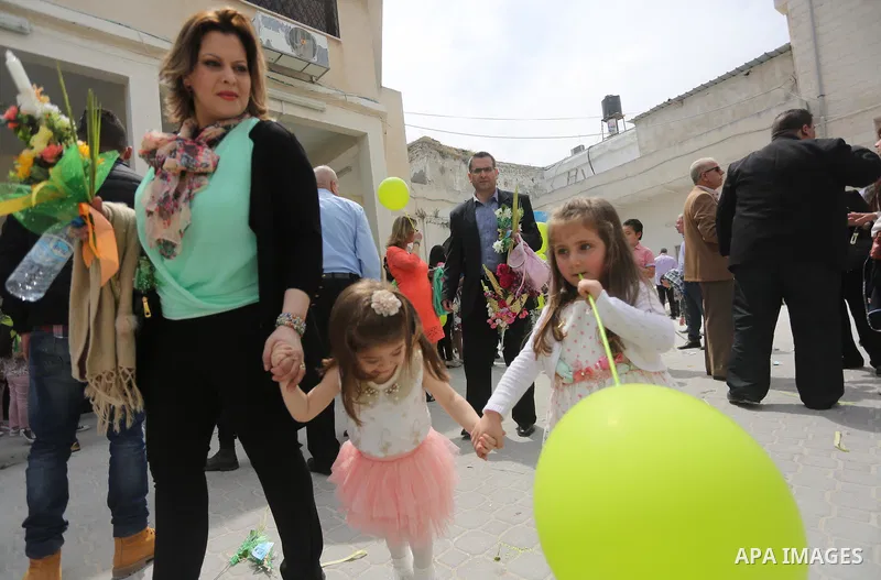 Palestinian Christians take part in the Greek Orthodox Christian Palm Sunday celebrations at St.Porphyrios Church in Gaza City, on April 9, 2017. Palm Sunday marks the triumphant return of Jesus Christ to Jerusalem when...