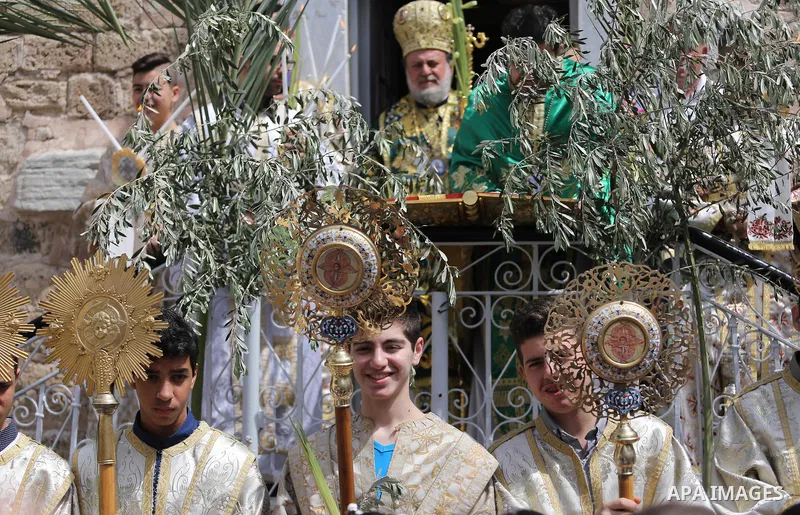 Palestinian Christians take part in the Greek Orthodox Christian Palm Sunday celebrations at St.Porphyrios Church in Gaza City, on April 9, 2017. Palm Sunday marks the triumphant return of Jesus Christ to Jerusalem when...