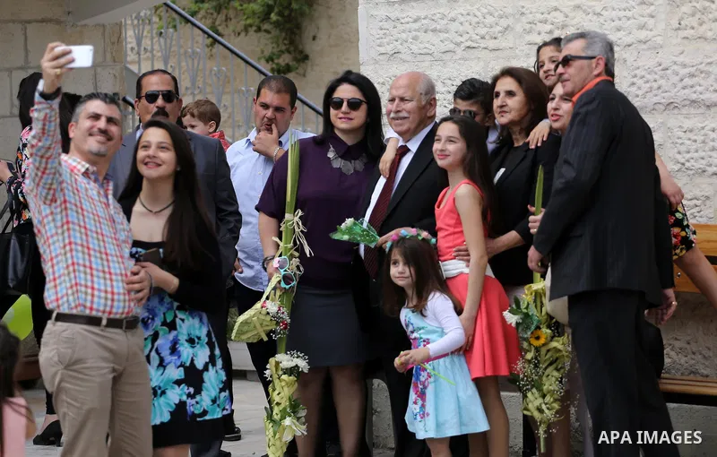 Palestinian Christians take part in the Greek Orthodox Christian Palm Sunday celebrations at St.Porphyrios Church in Gaza City, on April 9, 2017. Palm Sunday marks the triumphant return of Jesus Christ to Jerusalem when...