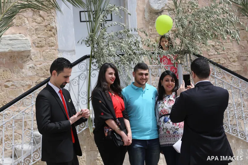Palestinian Christians take part in the Greek Orthodox Christian Palm Sunday celebrations at St.Porphyrios Church in Gaza City, on April 9, 2017. Palm Sunday marks the triumphant return of Jesus Christ to Jerusalem when...
