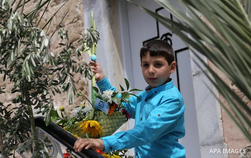 Palestinian Christians take part in the Greek Orthodox Christian Palm Sunday celebrations at St.Porphyrios Church in Gaza City, on April 9, 2017. Palm Sunday marks the triumphant return of Jesus Christ to Jerusalem when...