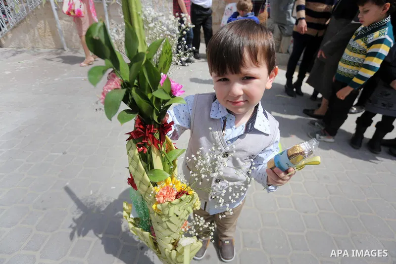 Palestinian Christians take part in the Greek Orthodox Christian Palm Sunday celebrations at St.Porphyrios Church in Gaza City, on April 9, 2017. Palm Sunday marks the triumphant return of Jesus Christ to Jerusalem when...
