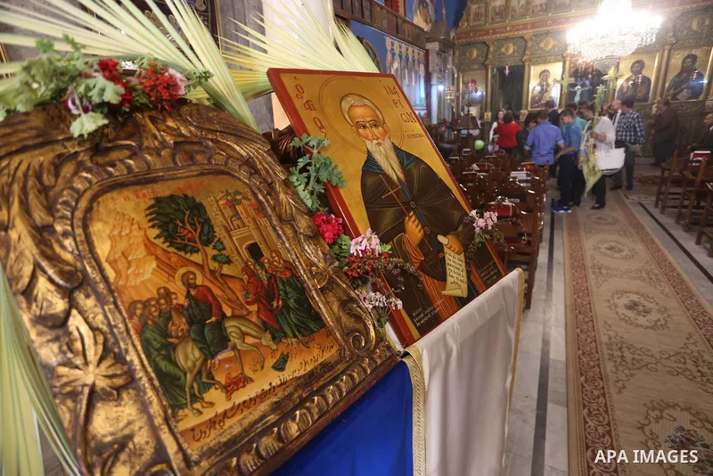 Palestinian Christians take part in the Greek Orthodox Christian Palm Sunday celebrations at St.Porphyrios Church in Gaza City, on April 9, 2017. Palm Sunday marks the triumphant return of Jesus Christ to Jerusalem when...