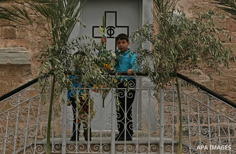 Palestinian Christians take part in the Greek Orthodox Christian Palm Sunday celebrations at St.Porphyrios Church in Gaza City, on April 9, 2017. Palm Sunday marks the triumphant return of Jesus Christ to Jerusalem when...