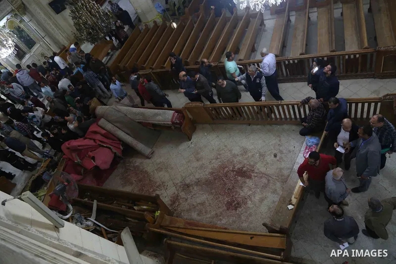 A picture taken on April 9, 2017 shows a general view of the destruction, debris, and blood stains on the benches of the Mar Girgis Coptic Orthodox Church in the Nile Delta City of Tanta, 120 kilometres (75 miles) north...