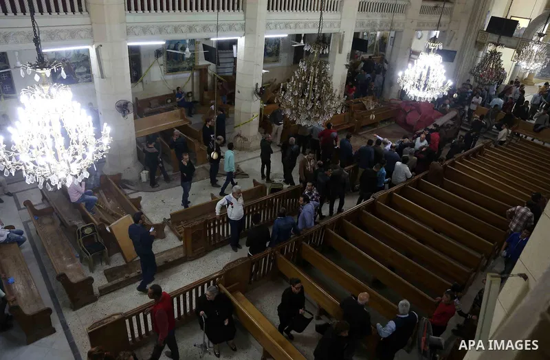 A picture taken on April 9, 2017 shows a general view of the destruction, debris, and blood stains on the benches of the Mar Girgis Coptic Orthodox Church in the Nile Delta City of Tanta, 120 kilometres (75 miles) north...