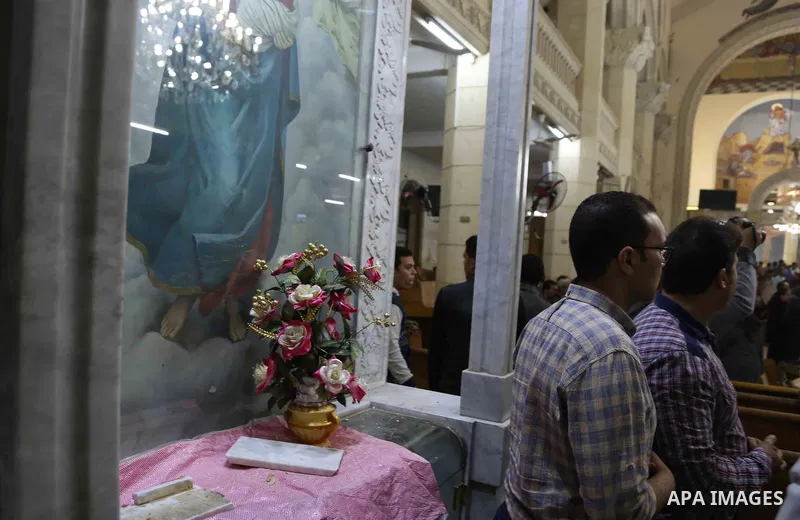 A picture taken on April 9, 2017 shows a general view of the destruction, debris, and blood stains on the benches of the Mar Girgis Coptic Orthodox Church in the Nile Delta City of Tanta, 120 kilometres (75 miles) north...