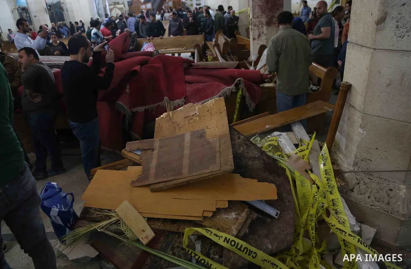 A picture taken on April 9, 2017 shows a general view of the destruction, debris, and blood stains on the benches of the Mar Girgis Coptic Orthodox Church in the Nile Delta City of Tanta, 120 kilometres (75 miles) north...