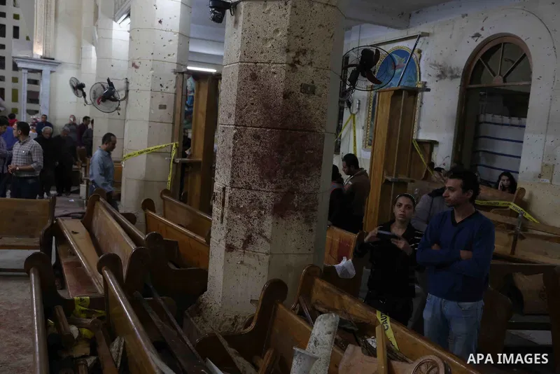A picture taken on April 9, 2017 shows a general view of the destruction, debris, and blood stains on the benches of the Mar Girgis Coptic Orthodox Church in the Nile Delta City of Tanta, 120 kilometres (75 miles) north...