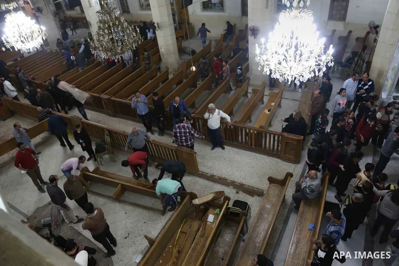 A picture taken on April 9, 2017 shows a general view of the destruction, debris, and blood stains on the benches of the Mar Girgis Coptic Orthodox Church in the Nile Delta City of Tanta, 120 kilometres (75 miles) north...