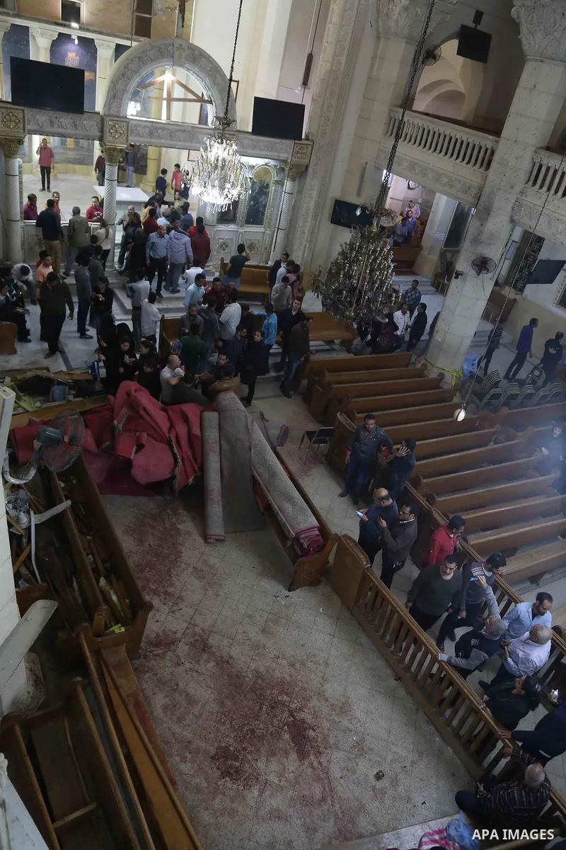 A picture taken on April 9, 2017 shows a general view of the destruction, debris, and blood stains on the benches of the Mar Girgis Coptic Orthodox Church in the Nile Delta City of Tanta, 120 kilometres (75 miles) north...