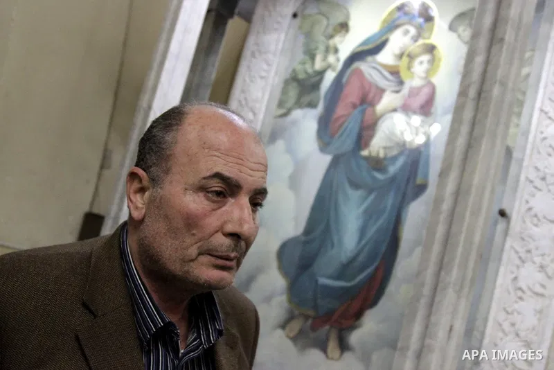 Relatives of a victim react inside the Mar Girgis Coptic Orthodox Church that was bombed on Sunday in the Nile Delta City of Tanta, 120 kilometres (75 miles) north of Cairo, at which a bomb blast struck worshippers gathe...