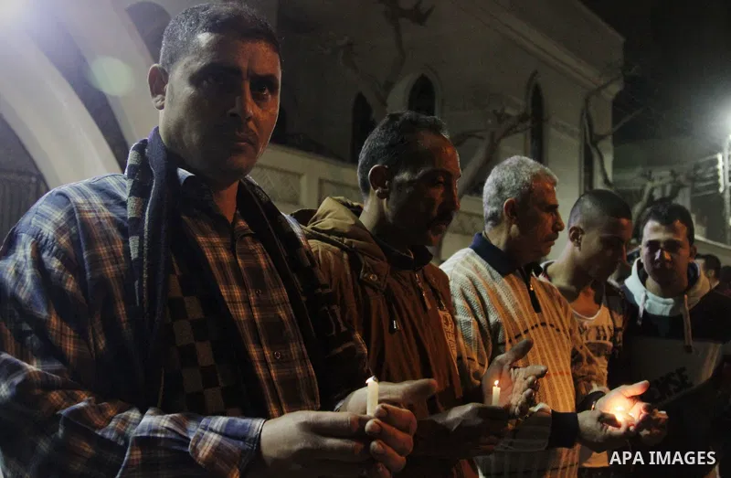 Relatives of a victim react inside the Mar Girgis Coptic Orthodox Church that was bombed on Sunday in the Nile Delta City of Tanta, 120 kilometres (75 miles) north of Cairo, at which a bomb blast struck worshippers gathe...