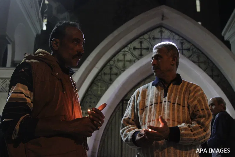 Relatives of a victim react inside the Mar Girgis Coptic Orthodox Church that was bombed on Sunday in the Nile Delta City of Tanta, 120 kilometres (75 miles) north of Cairo, at which a bomb blast struck worshippers gathe...