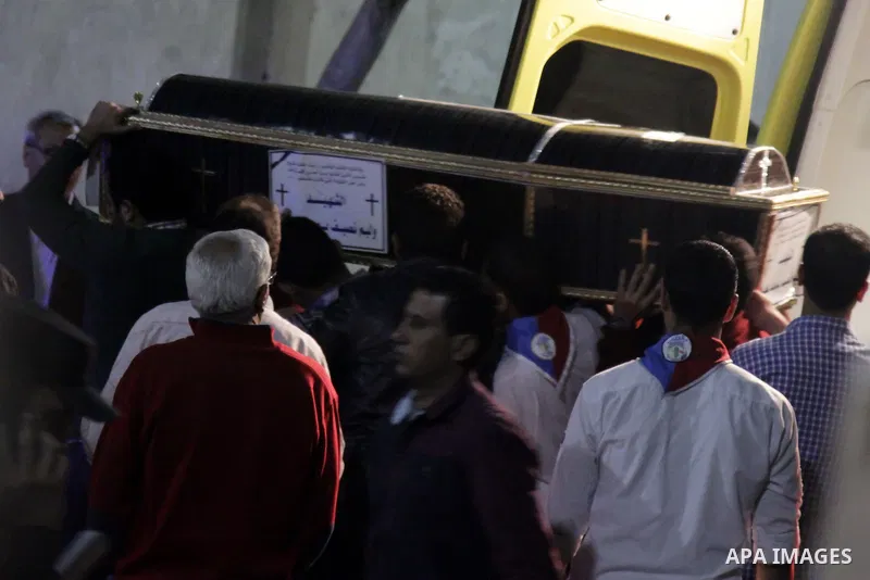 Relatives of victims react to coffins arriving to the Mar Girgis Coptic Orthodox Church in the Nile Delta City of Tanta, 120 kilometres (75 miles) north of Cairo, at which a bomb blast struck worshippers gathering to att...