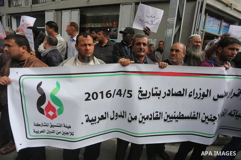 Palestinian refugees from Syrian, Yemen, Libya, take part in a protest in Gaza city on April 10, 2017. Photo by Mohammed Asad