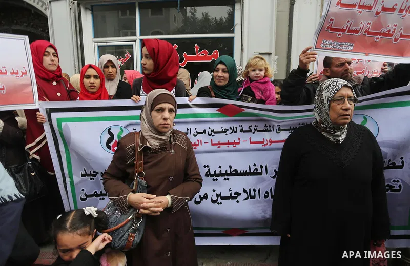 Palestinian refugees from Syrian, Yemen, Libya, take part in a protest in Gaza city on April 10, 2017. Photo by Mohammed Asad