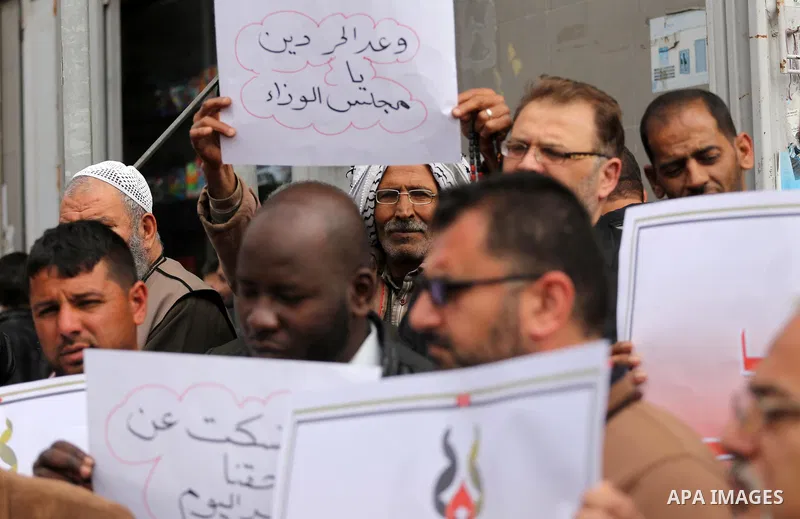 Palestinian refugees from Syrian, Yemen, Libya, take part in a protest in Gaza city on April 10, 2017. Photo by Mohammed Asad