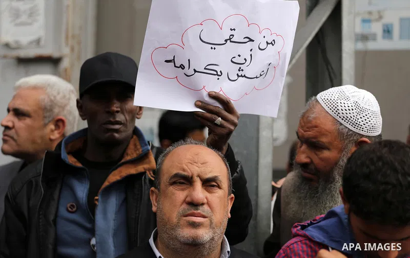 Palestinian refugees from Syrian, Yemen, Libya, take part in a protest in Gaza city on April 10, 2017. Photo by Mohammed Asad