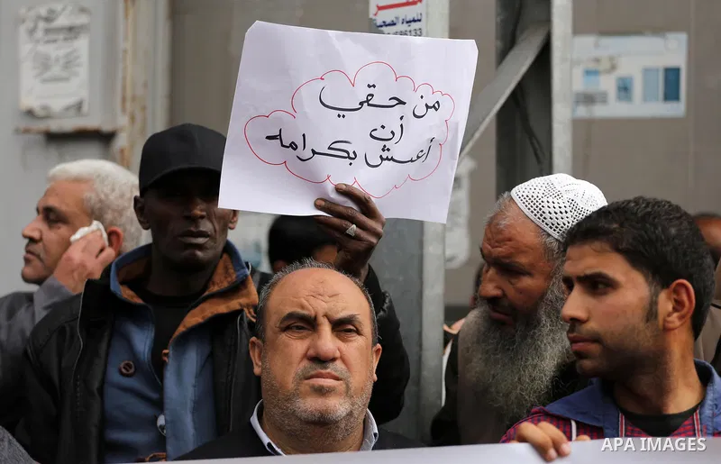 Palestinian refugees from Syrian, Yemen, Libya, take part in a protest in Gaza city on April 10, 2017. Photo by Mohammed Asad