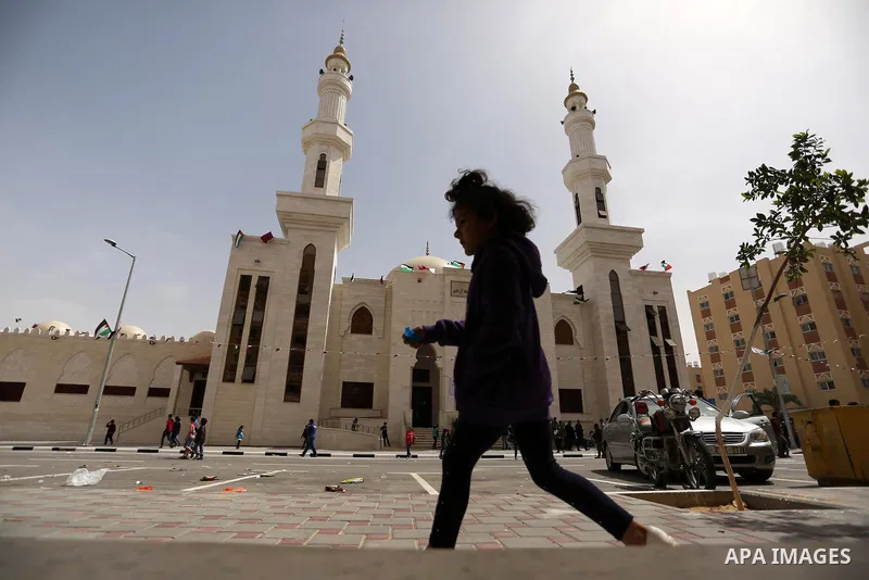 Palestinians attend the opening ceremony of Sheikh Hamad's mosque, in Khan Younis in the southern Gaza strip, on April 10, 2017. Photo by Ashraf Amra