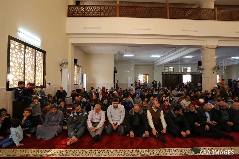 Palestinians attend the opening ceremony of Sheikh Hamad's mosque, in Khan Younis in the southern Gaza strip, on April 10, 2017. Photo by Ashraf Amra