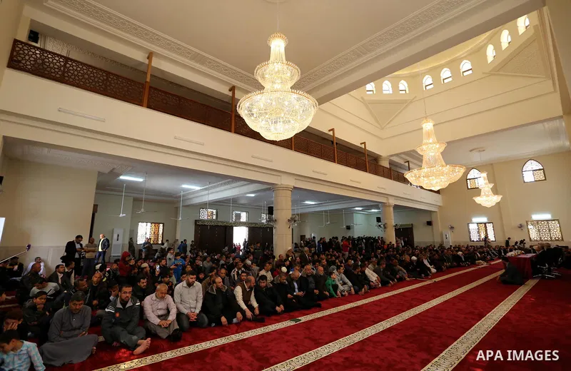 Palestinians attend the opening ceremony of Sheikh Hamad's mosque, in Khan Younis in the southern Gaza strip, on April 10, 2017. Photo by Ashraf Amra