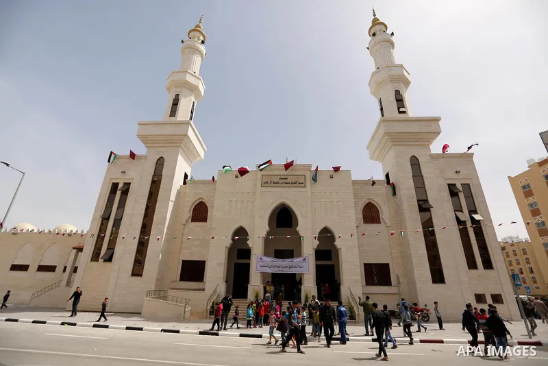 Palestinians attend the opening ceremony of Sheikh Hamad's mosque, in Khan Younis in the southern Gaza strip, on April 10, 2017. Photo by Ashraf Amra