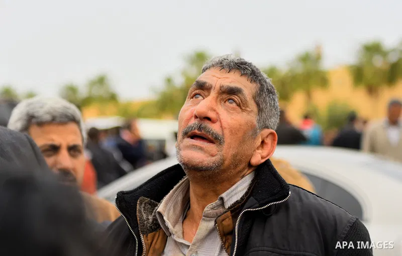 An Egyptian Christian man mourns for the victims of the blast at the Coptic Christian Saint Mark's church in Alexandria the previous day during a funeral procession at the Monastery of Marmina in the city of Borg El-Arab...