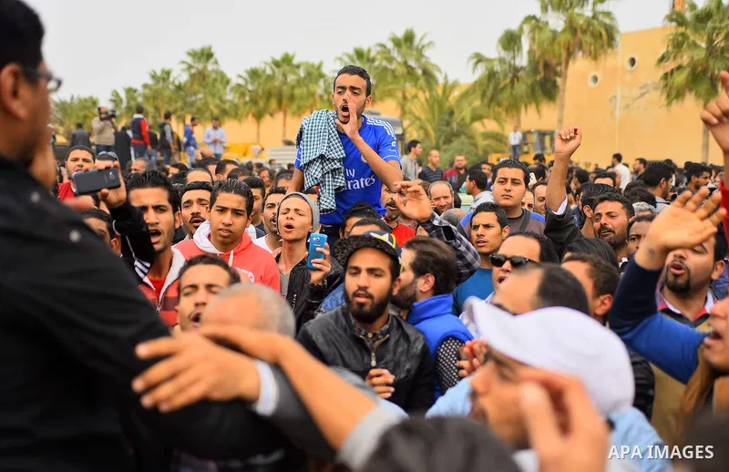 Egyptian Christians mourn for the victims of the blast at the Coptic Christian Saint Mark's church in Alexandria the previous day during a funeral procession at the Monastery of Marmina in the city of Borg El-Arab, east...