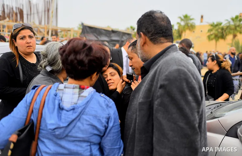 Egyptian Christians mourn for the victims of the blast at the Coptic Christian Saint Mark's church in Alexandria the previous day during a funeral procession at the Monastery of Marmina in the city of Borg El-Arab, east...