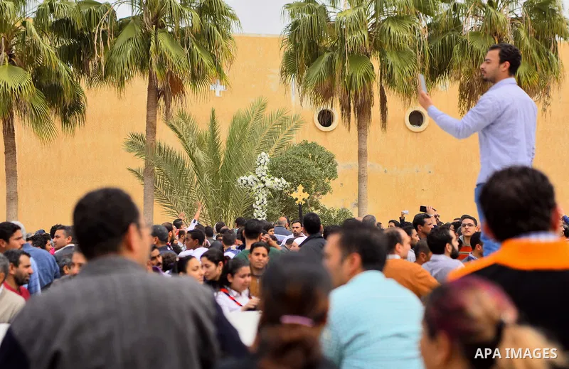 Egyptian Christians mourn for the victims of the blast at the Coptic Christian Saint Mark's church in Alexandria the previous day during a funeral procession at the Monastery of Marmina in the city of Borg El-Arab, east...