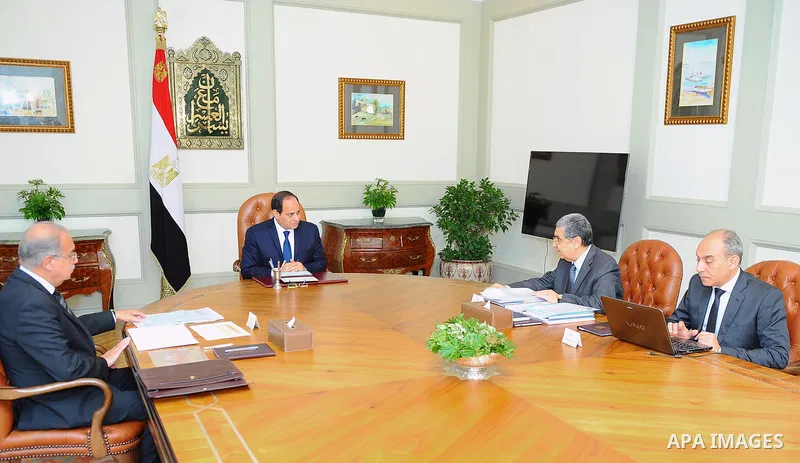 Egyptian President Abdel Fattah al-Sisi chairs a meeting with Prime Minister Sherif Ismail and Minister of Electricity and Renewable Energy Mohammed Shaker, in Cairo, Egypt, on April 11, 2017. Photo by Egyptian President...