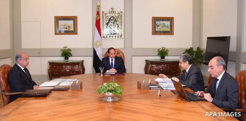 Egyptian President Abdel Fattah al-Sisi chairs a meeting with Prime Minister Sherif Ismail and Minister of Electricity and Renewable Energy Mohammed Shaker, in Cairo, Egypt, on April 11, 2017. Photo by Egyptian President...